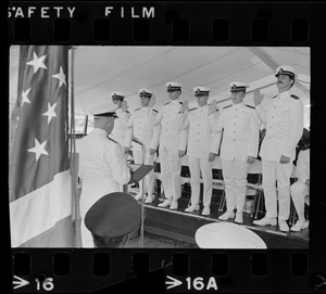 Rear Admiral J.C. Wylie, administers oath to Tufts University NROTC classmates who became ensigns in the US Navy