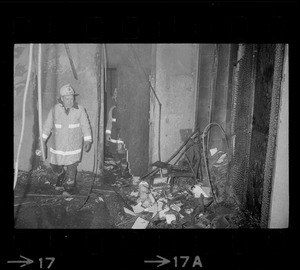 Firefighter views remains of firebombed office at Tufts University Fletcher School of Law and Diplomacy