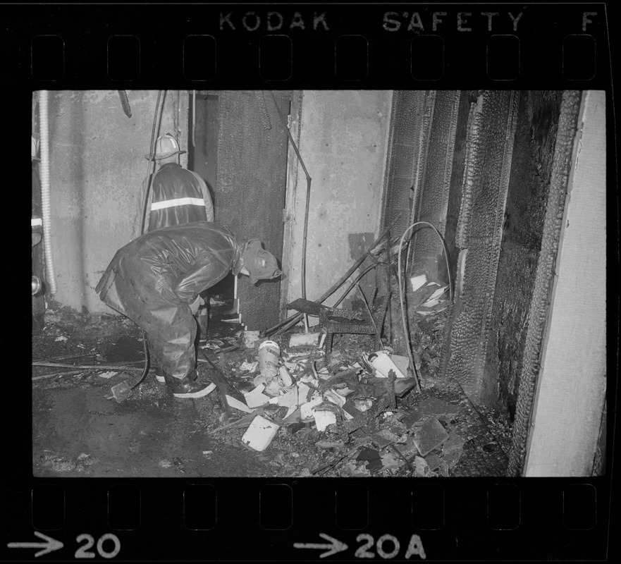 Firefighters looking through remains of firebombed office at Tufts University Fletcher School of Law and Diplomacy