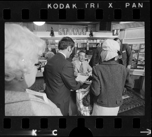 Lawrence Welk surrounded by fans at his book signing for his autobiography, "Wunnerful, Wunnerful," at Jordan's Bookmart