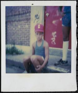 Kymio Postell in red hat