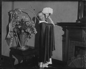 Aimee Semple McPherson, evangelist, posed with bible raised