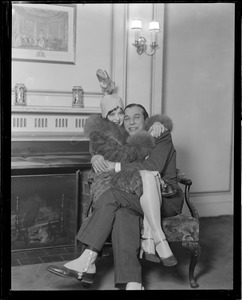 Movie star Clara bow sits in her fiancé Harry Richman's lap during her overnight stay in Boston at Ritz-Carlton