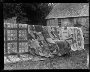 Mrs. Prescott making huge quilt outside of home in New London, N.H.