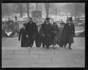 Capt. George Fried and wife going up the State House steps while in Boston