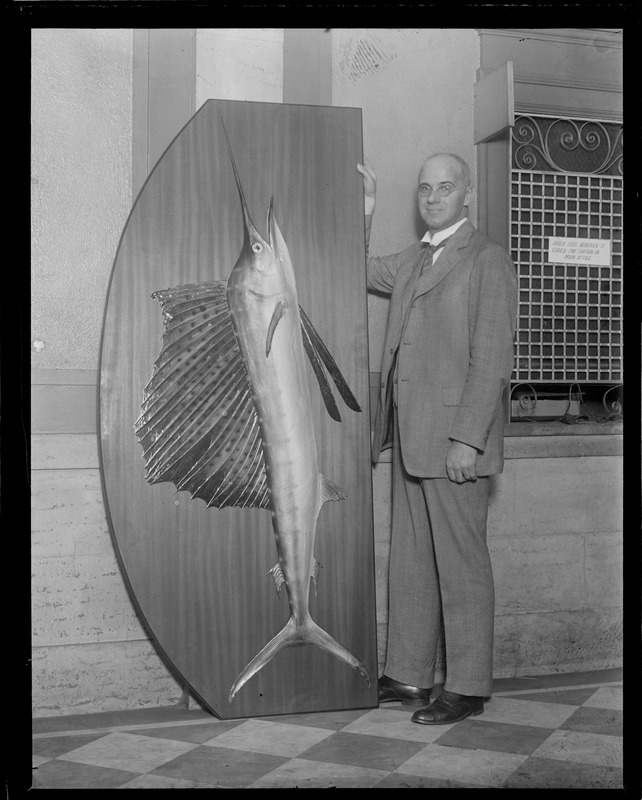 Dean Gleason L. Archer of the Suffolk law school with the big fish he caught off Miami