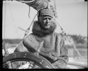 Donald B. MacMillan at the wheel of the ship Bowdoin he used in Labrador (14 months)