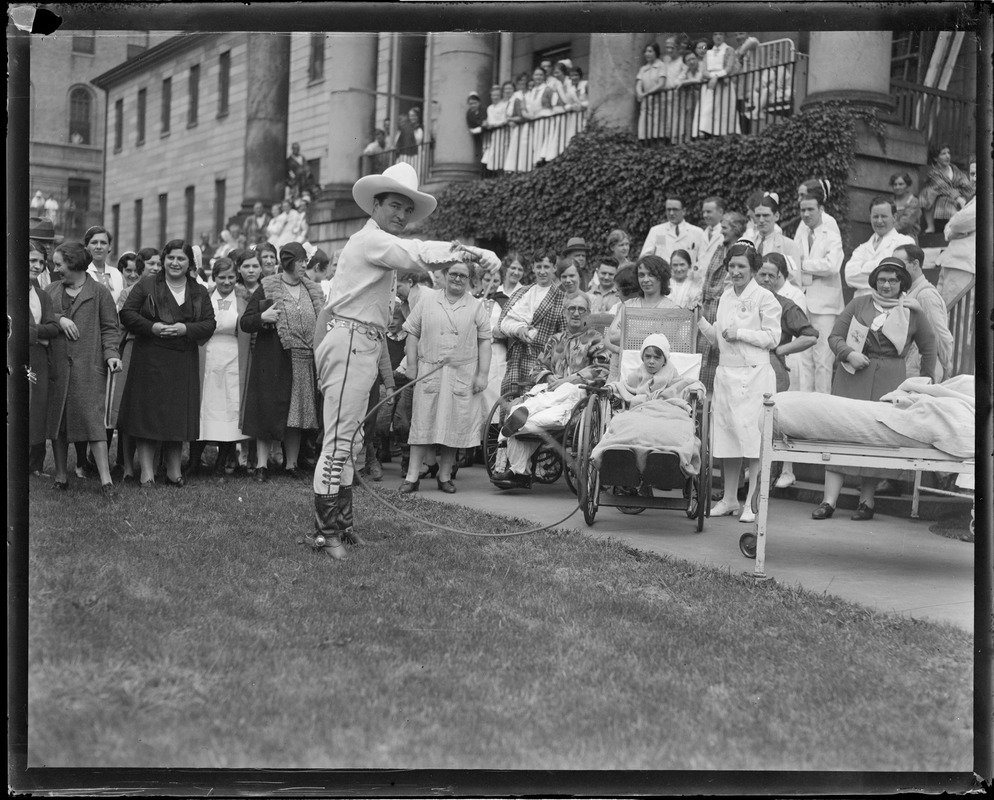 Tom Mix performs rope tricks for invalids at Mass. General