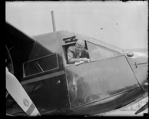 Will Rogers looks out the cockpit of plane at East Boston Airport during his last visit to Boston before he was killed in a plane crash with Wiley Post in Alaska
