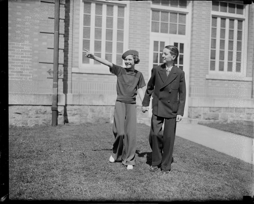 Alyce McHenry holding hands with boy, they both had their stomachs upside down