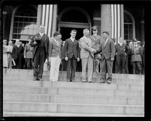 Group including James Curley and Joseph B. Ely on State House steps