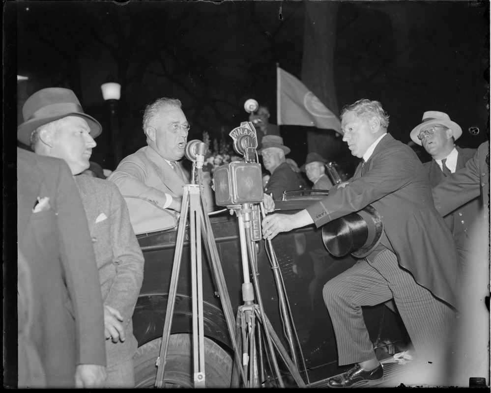 Curley adjusts microphone for Franklin Delano Roosevelt during campaign in Boston