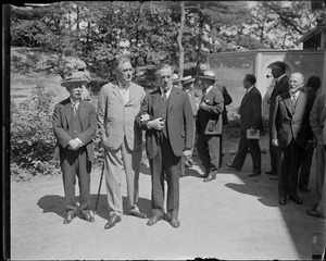 Franklin Delano Roosevelt on the arm of J.M. Curley, Col. House on the left