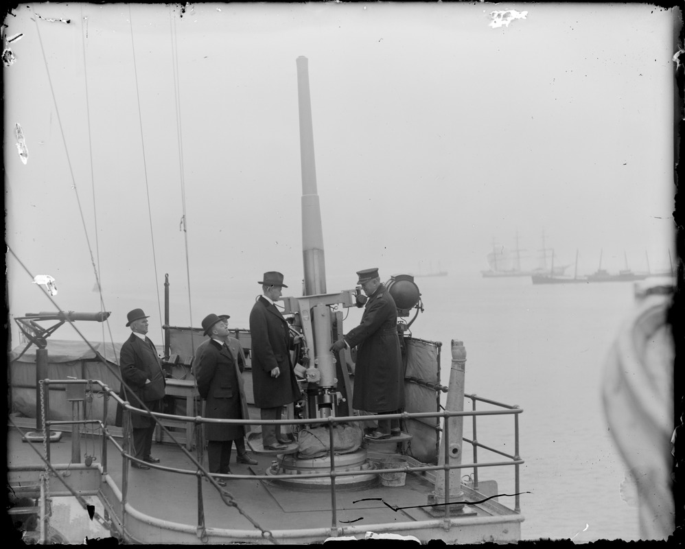 Gov. Coolidge and Mayor Peters inspecting famous anti aircraft gun on the USS Kentucky