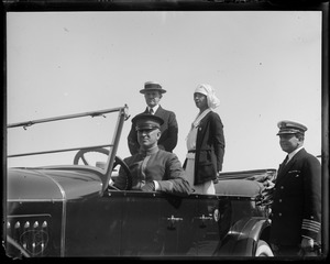 Pres. Coolidge and wife getting into car at Plymouth, MA