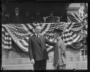 Gov. Coolidge with high school cadet Francis Jenkins in front of State House. Jenkins is attached to Col. George Benyon's staff.