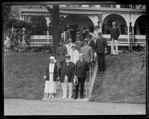 Pres. and Mrs. Coolidge at Clarence Barron's summer home in Cohasset. Barron with beard and walking stick.