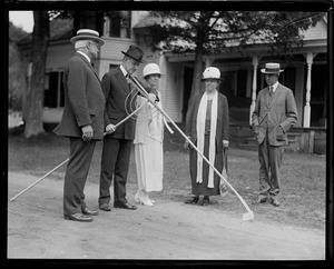 Pres. Coolidge presented with rakes
