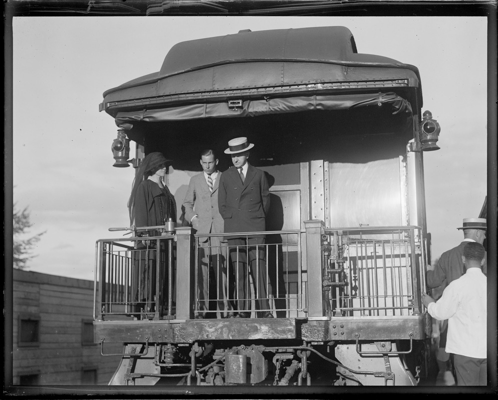 Pres. and Mrs. Coolidge and son John leaving Ludlow, VT station on route to Capitol