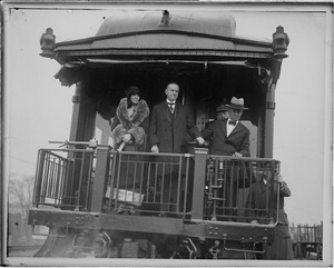 Pres. and Mrs. Coolidge arrive by train in Northampton to cast vote for Hoover