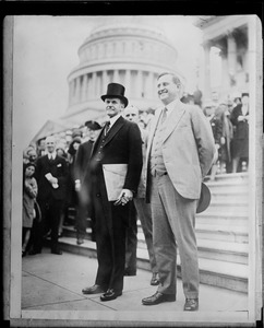 Pres. Coolidge and his secretary Everett Saunders leaving capital after adjournment of first session of the 70th Congress