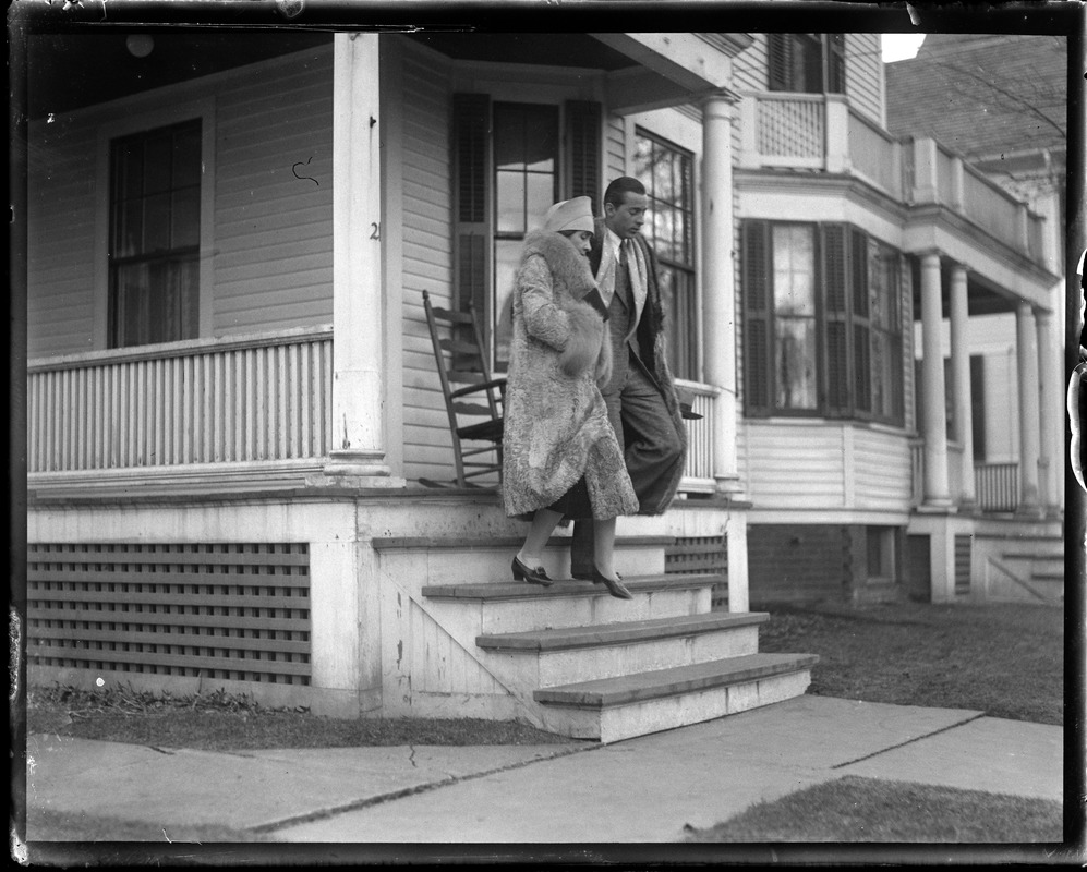 Mrs. Coolidge and son John leaving her mother's home at 21 Massasoit St., Northampton