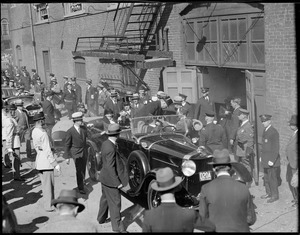 Pres. and Mrs. Hoover arrive by automobile at rear entrance to Boston Arena
