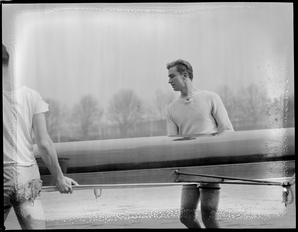 Franklin Delano Roosevelt, Jr. helping to put boat in Charles while with Harvard crew