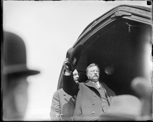 Teddy Roosevelt doffs his hat