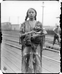 Squaw with child at train station