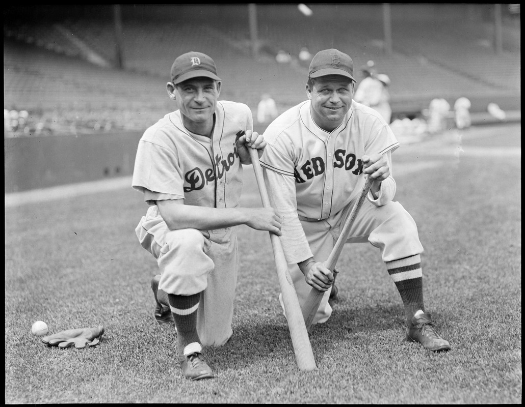 Jimmie Foxx smoking cigar in hotel bed - Digital Commonwealth