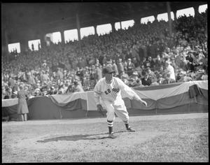 Lefty Grove, Red Sox pitcher, warms up in front of stands at Fenway
