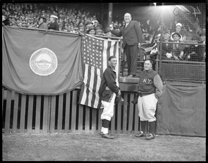 Throwing out the first ball at Fenway, Red Sox third baseman/manager Marty McManus and Yankees manager Joe McCarthy look on
