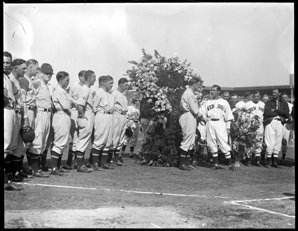 Joe Cronin of the Washington Senators shakes hands with Red Sox manager Bucky Harris