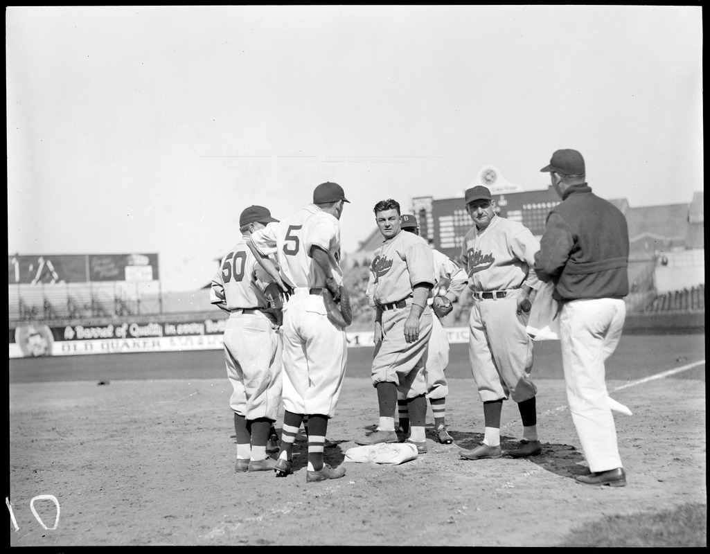 Boston Braves and Philadelphia Phillies grouped around first base at Braves Field