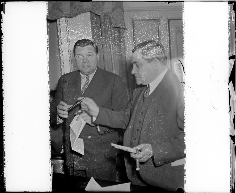 Babe Ruth and Judge Fuchs smoke cigars to celebrate Ruth signing with Braves