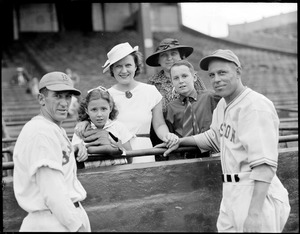 Boston Bees players pose with women and children in stands