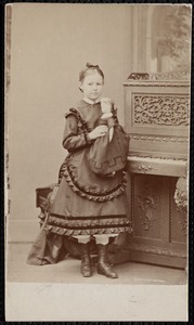 Mary Faulkner holding doll