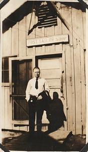 Unidentified man in front of the Post Tailor Shop, Marine base Quantico, VA