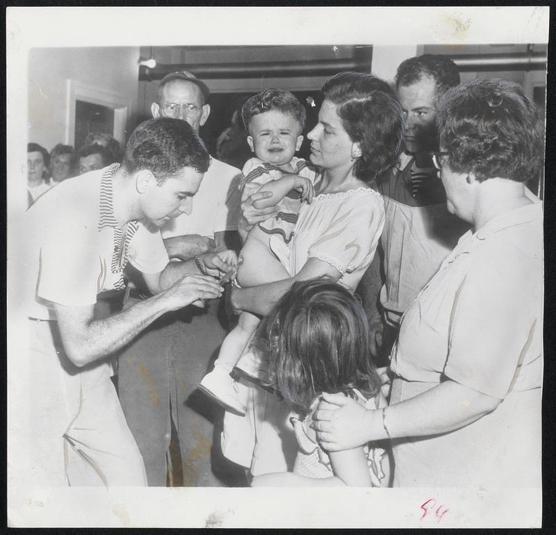 Big Bellow is let out by Daniel Heckman, 14 months, as he is given an anti-typhoid shot at East Stroudsburg, Pa. All residents of that hard-hit area were innoculated against disease threat.