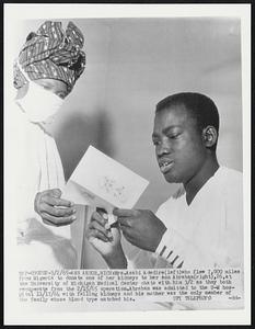 Ann Abor, Mich: Mrs. Asabi Adedire (left) who flew 7,000 miles from Nigeria to donate one of her kidneys to her son Abraham(right). 26, at the University of Michigan Medical Center chats with him 3/2 as they both recuperate from the 2/15/65 operation. Abraham was admitted to the U-M hospital 11/17/64 with falling kidneys and his mother was the only member of the family whose blood type matched his.