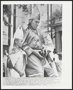 Klansman and Klan Girls--Klansman Gerald Simerly of Knoxville, Tenn., and two young girls rode a pickup truck at the head of a Ku Klux Klan march through downtown Atlanta. Simerly declined to identify the girls. About 500 persons took part in the march. A number of Negroes looked on but there were no incidents.