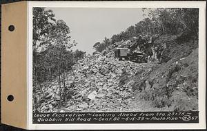 Contract No. 82, Constructing Quabbin Hill Road, Ware, ledge excavation, looking ahead from Sta. 23+75, Ware, Mass., Jun. 15, 1939