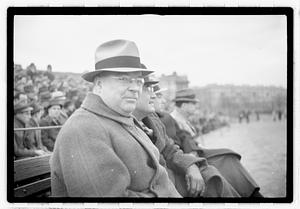 Boston Parks Department Commissioner William Long watching a football game, Back Bay Fens