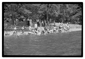 Boys sending out model sailboats
