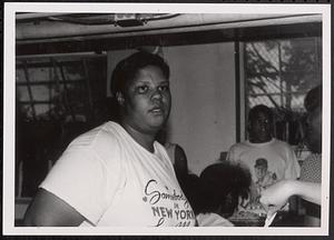 Young woman wearing a "Somebody in New York" shirt