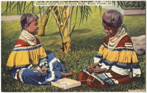 Seminole Indian girls stringing beads, Miami, Florida