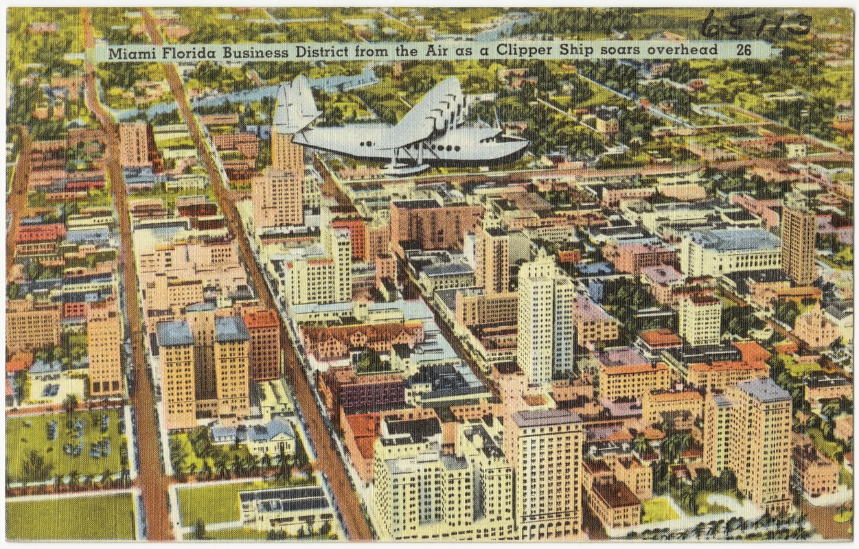 Miami, Florida business district from the air as a clipper ship soars overhead