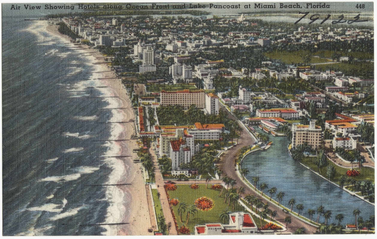Air view showing hotels along ocean front and Lake Pancoast at Miami Beach, Florida