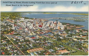 Aerial view of Miami, Florida looking north east shows part of Miami Beach in the background